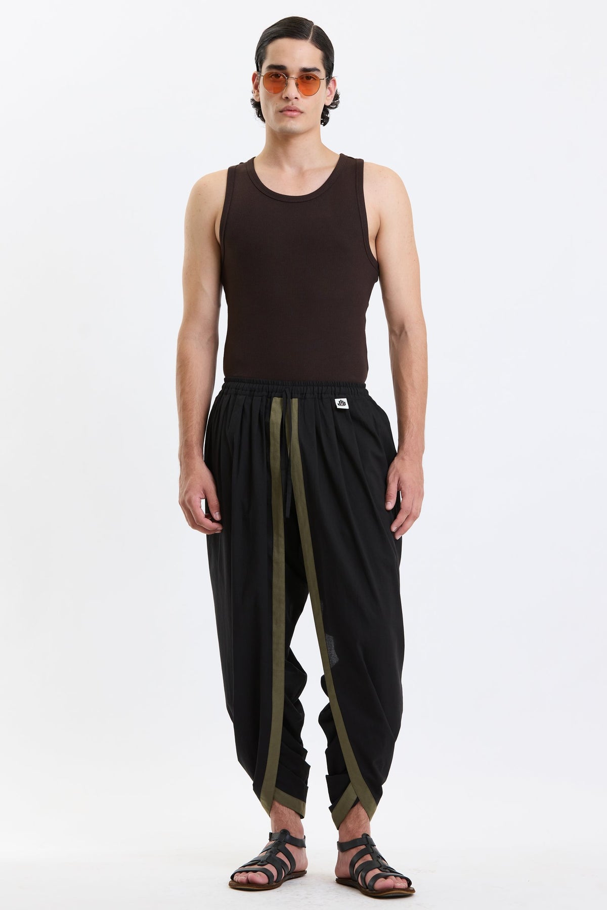 Cotton Dhoti Pants – Black & Olive by Swasthii, worn by a model – view 1