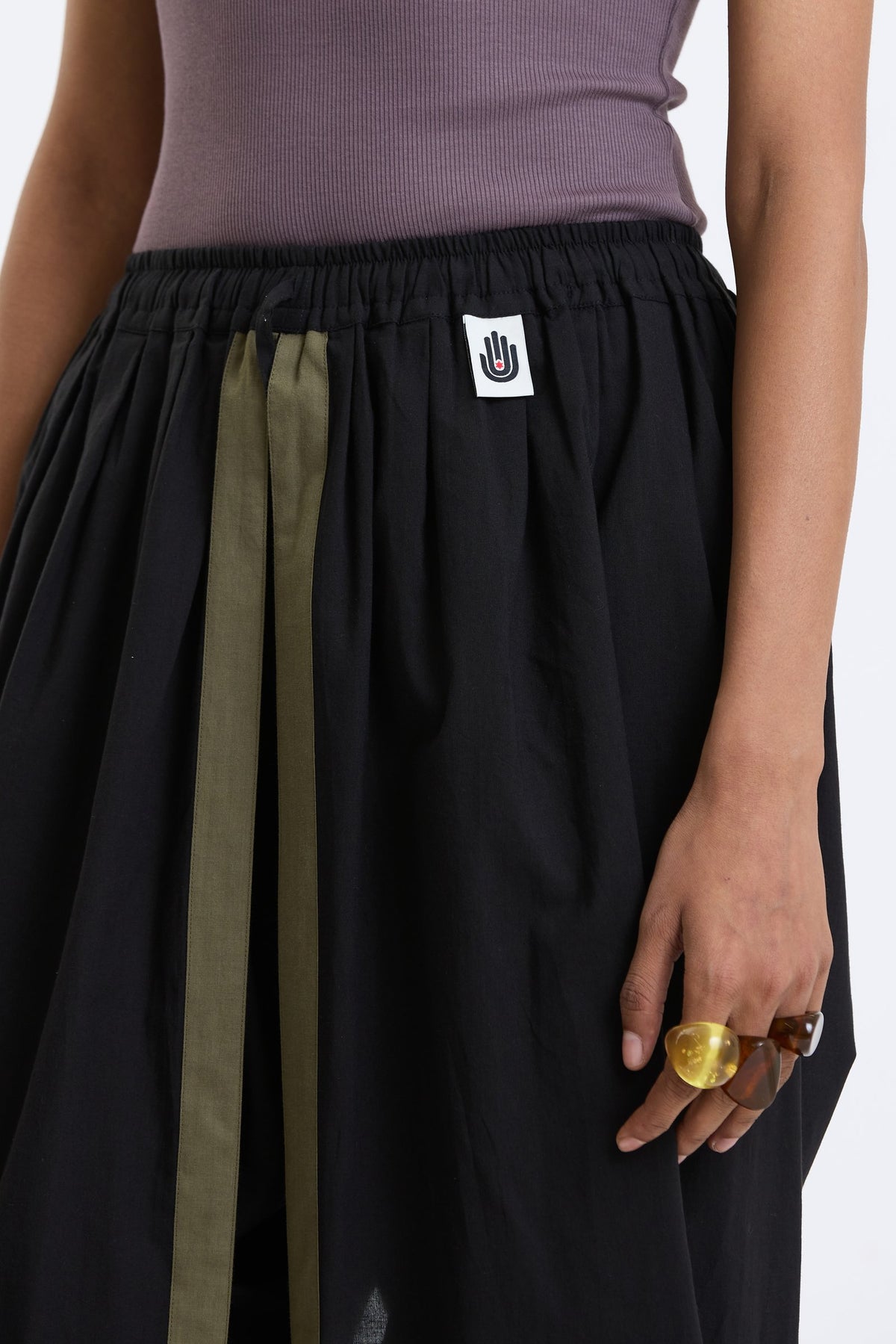 Cotton Dhoti Pants – Black & Olive by Swasthii, worn by a model – view 2