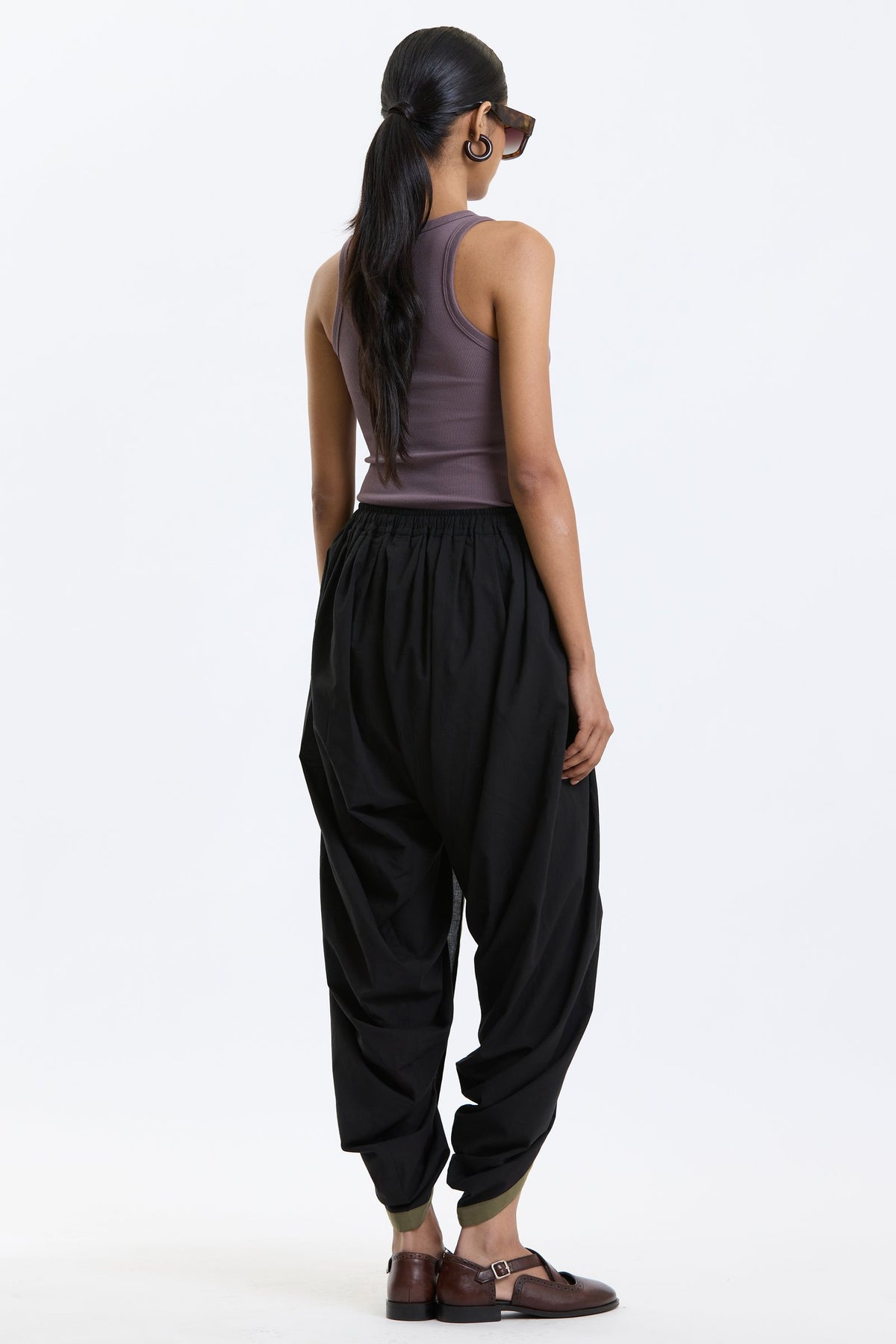 Cotton Dhoti Pants – Black & Olive by Swasthii, worn by a model – view 4