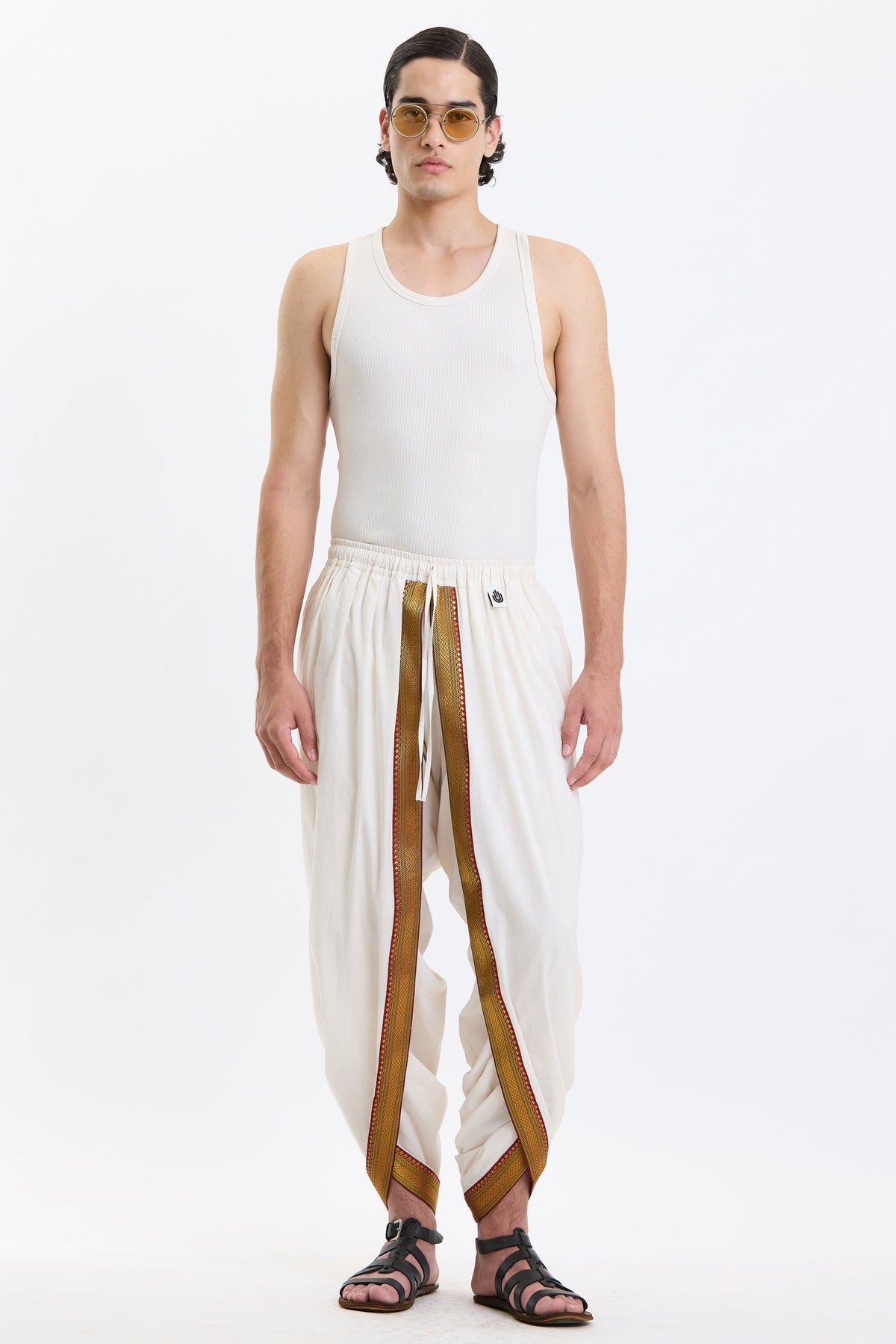 Cotton Dhoti Pants with Zari Border – White & Gold by Swasthii, worn by a model – view 1