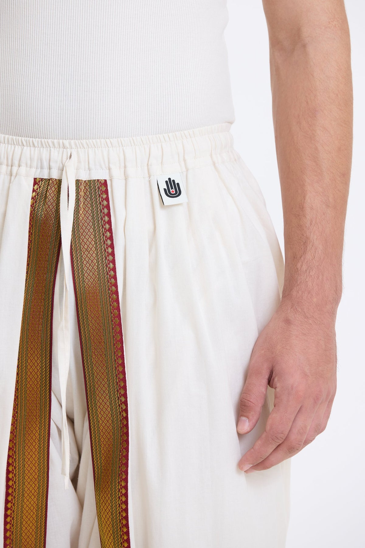 Cotton Dhoti Pants with Zari Border – White & Gold by Swasthii, worn by a model – view 2