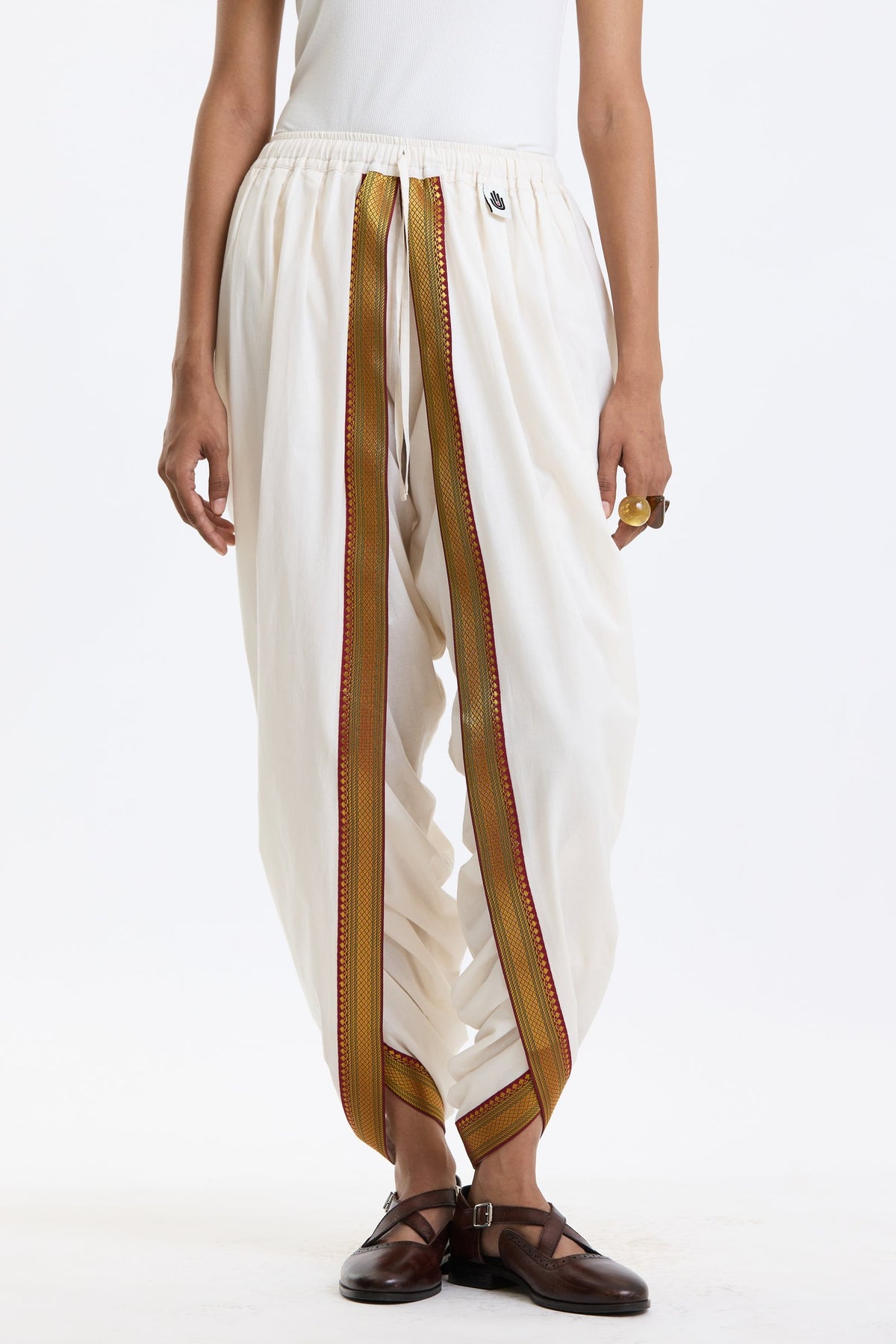 Cotton Dhoti Pants with Zari Border – White & Gold by Swasthii, worn by a model – view 3