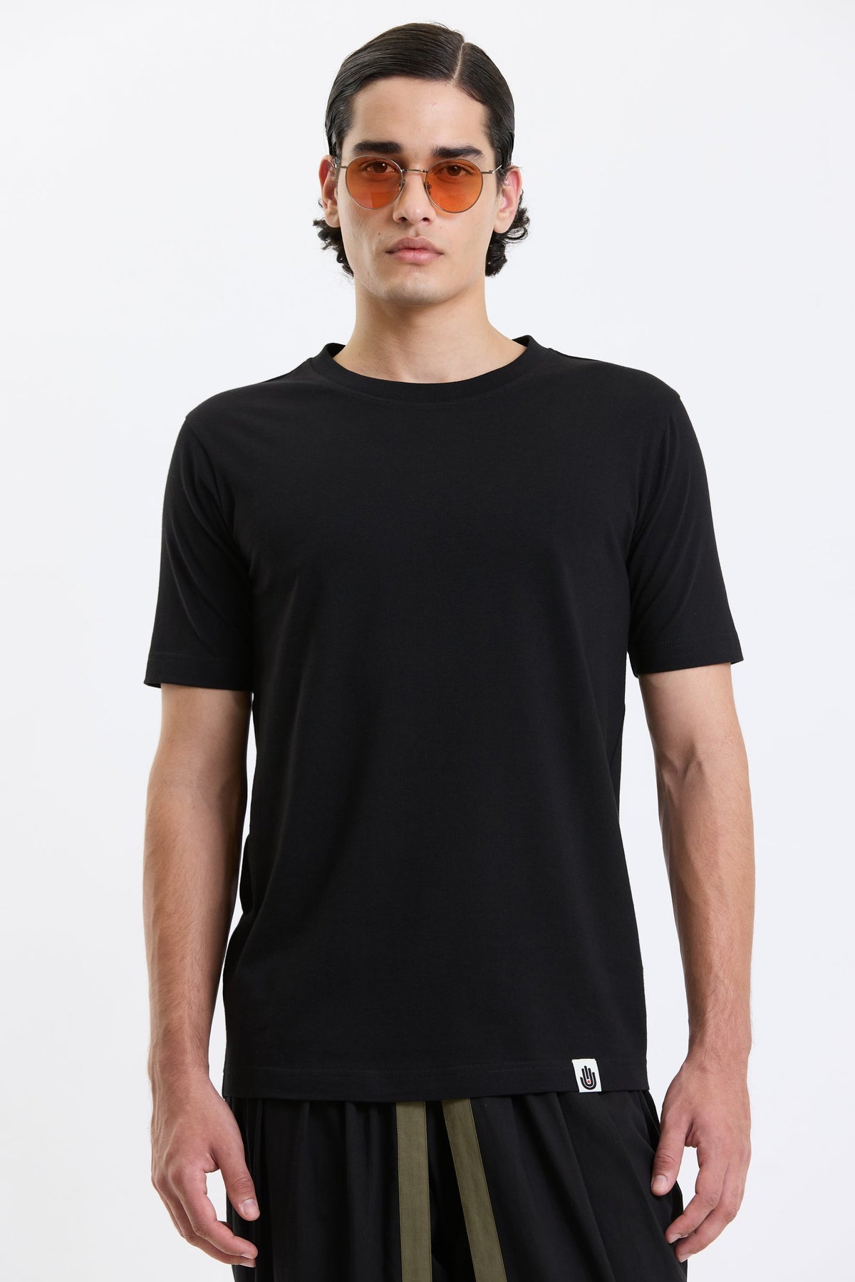 Cotton T-Shirt – Black by Swasthii, worn by a model – view 2
