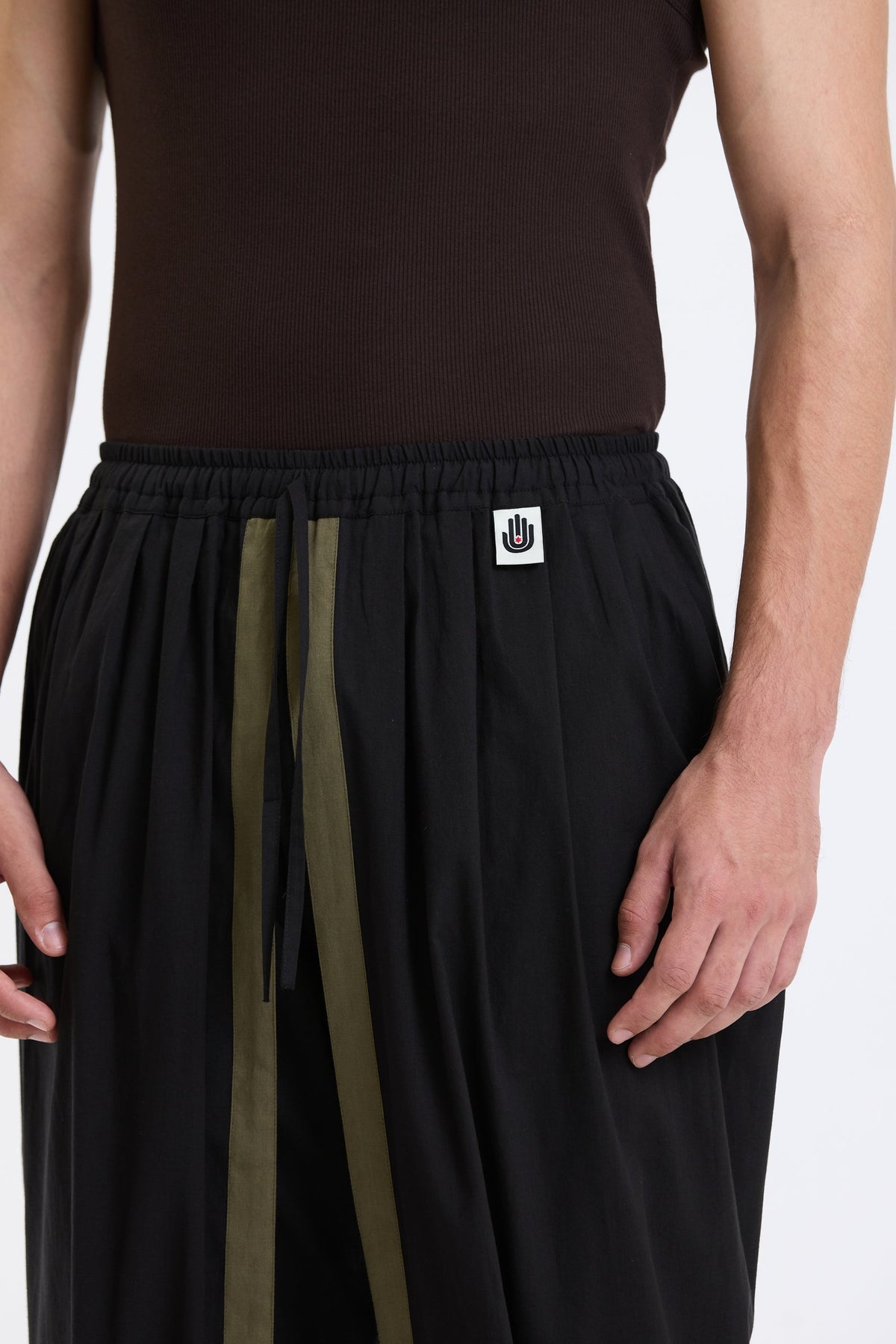 Cotton Dhoti Pants – Black & Olive by Swasthii, worn by a model – view 2