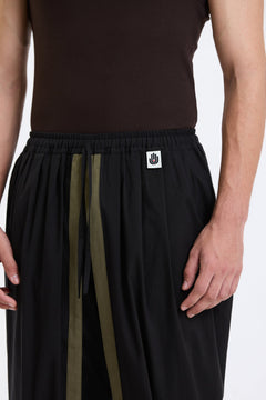 Cotton Dhoti Pants – Black & Olive by Swasthii, worn by a model – view 2