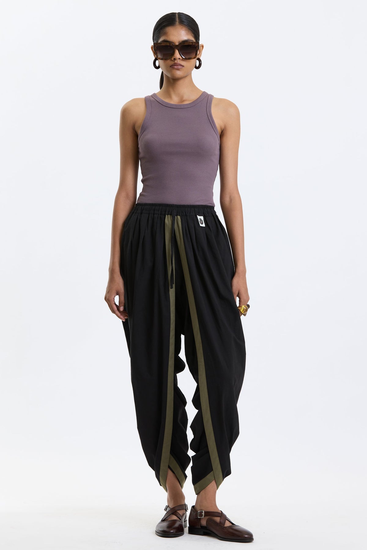 Cotton Dhoti Pants – Black & Olive by Swasthii, worn by a model – view 1