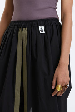 Cotton Dhoti Pants – Black & Olive by Swasthii, worn by a model – view 2