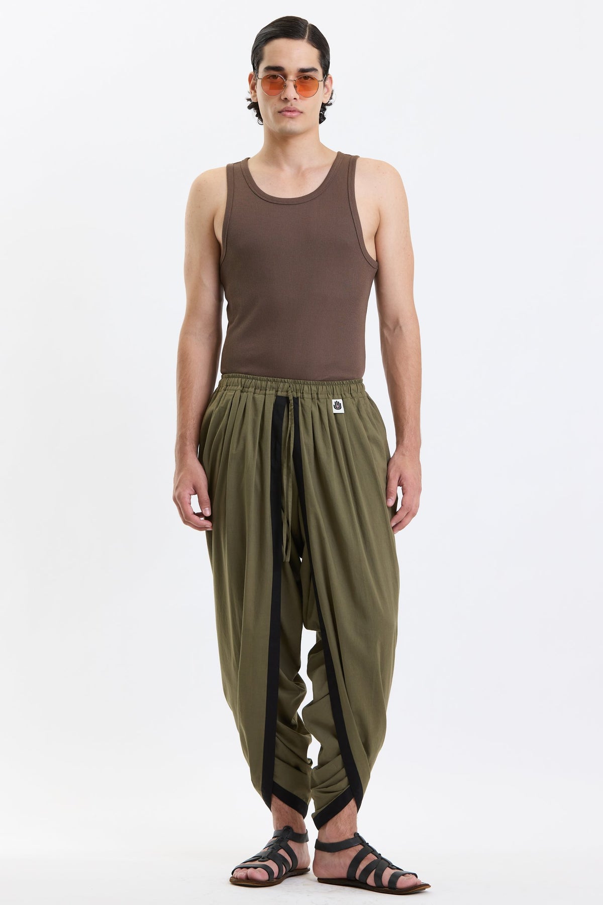 Cotton Dhoti Pants – Olive Green by Swasthii, worn by a model – view 1