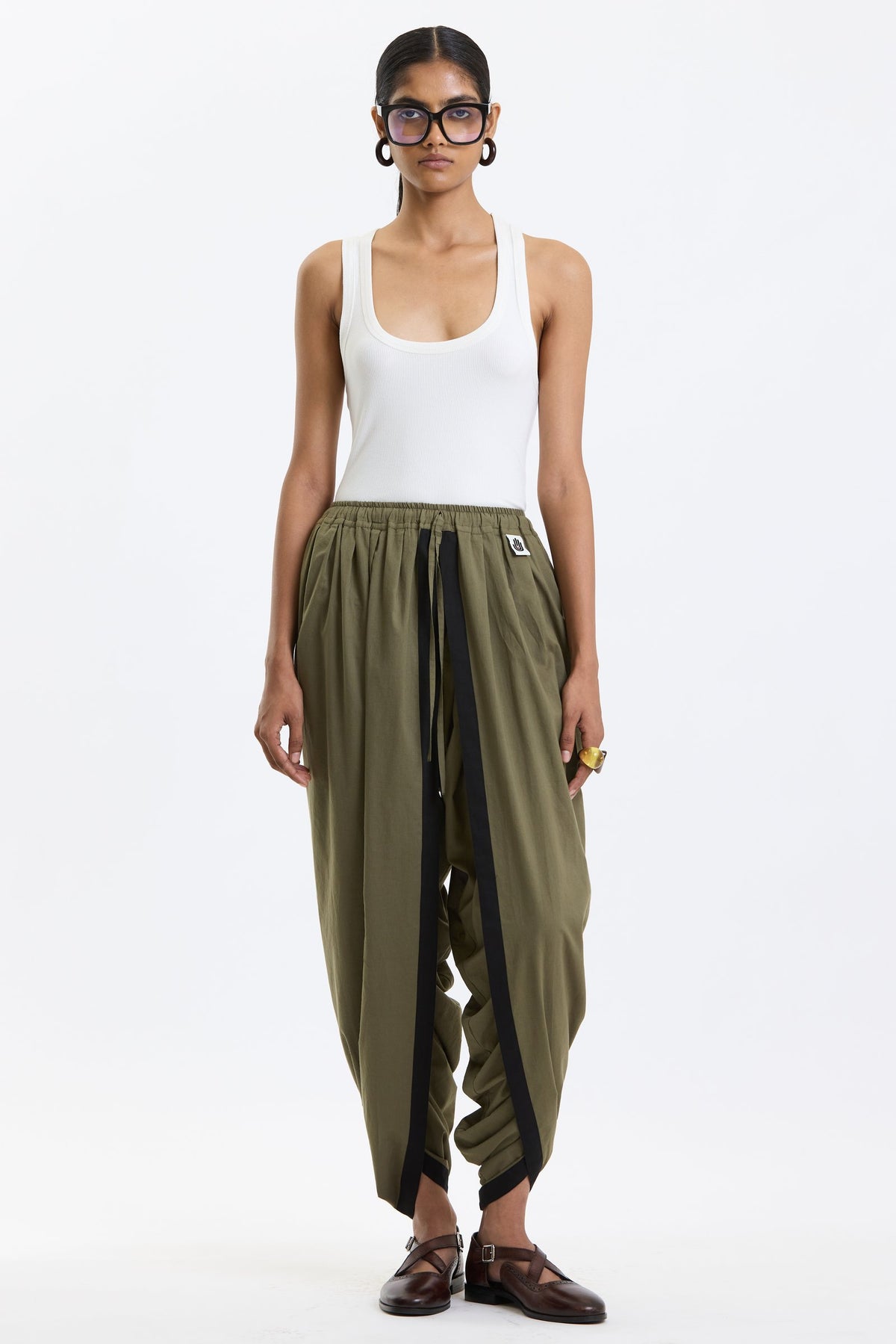 Cotton Dhoti Pants – Olive Green by Swasthii, worn by a model – view 1