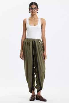 Cotton Dhoti Pants – Olive Green by Swasthii, worn by a model – view 1