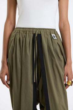 Cotton Dhoti Pants – Olive Green by Swasthii, worn by a model – view 3