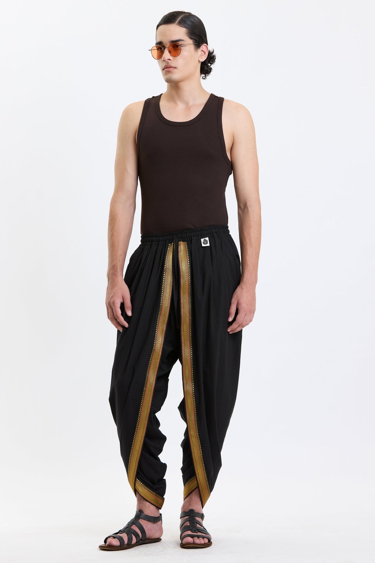Cotton Dhoti Pants with Zari Border – Black & Gold by Swasthii, worn by a model – view 2