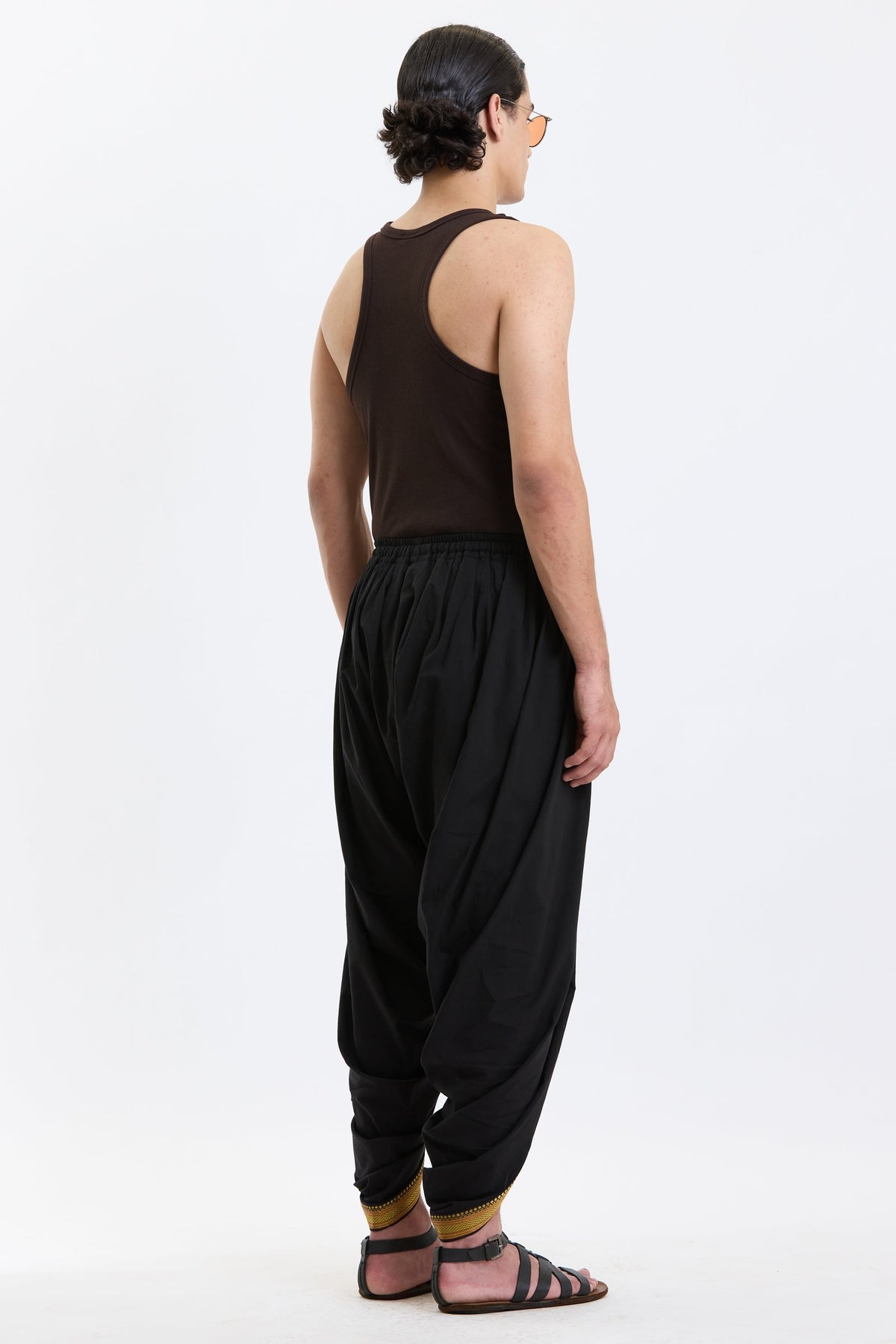 Cotton Dhoti Pants with Zari Border – Black & Gold by Swasthii, worn by a model – view 3