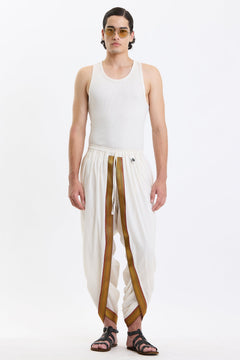 Cotton Dhoti Pants with Zari Border – White & Gold by Swasthii, worn by a model – view 1