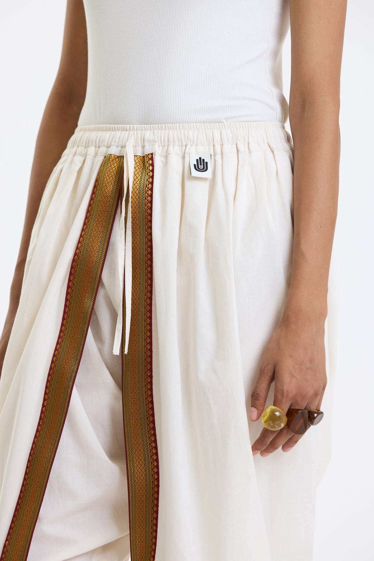 Cotton Dhoti Pants with Zari Border – White & Gold by Swasthii, worn by a model – view 2