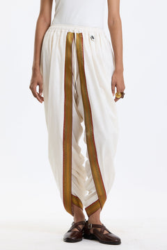 Cotton Dhoti Pants with Zari Border – White & Gold by Swasthii, worn by a model – view 3