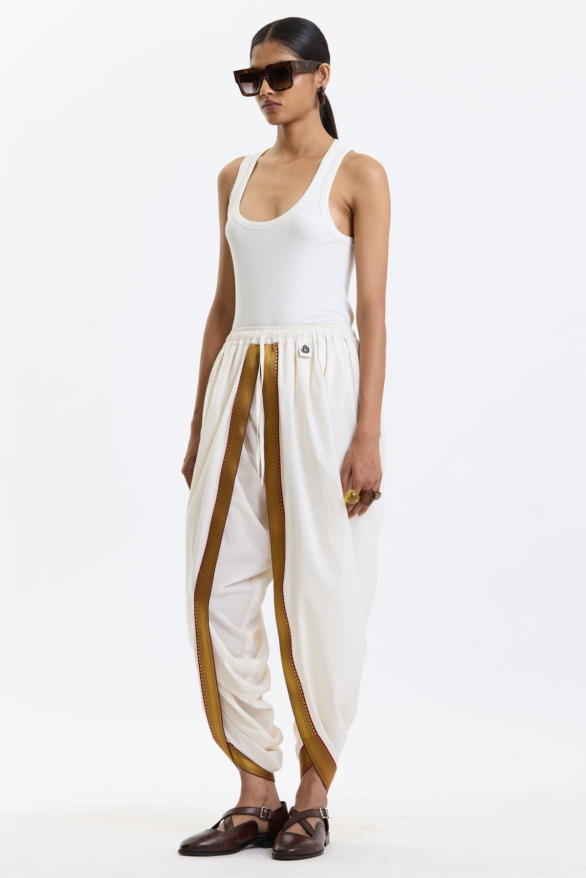 Cotton Dhoti Pants with Zari Border – White & Gold by Swasthii, worn by a model – view 4