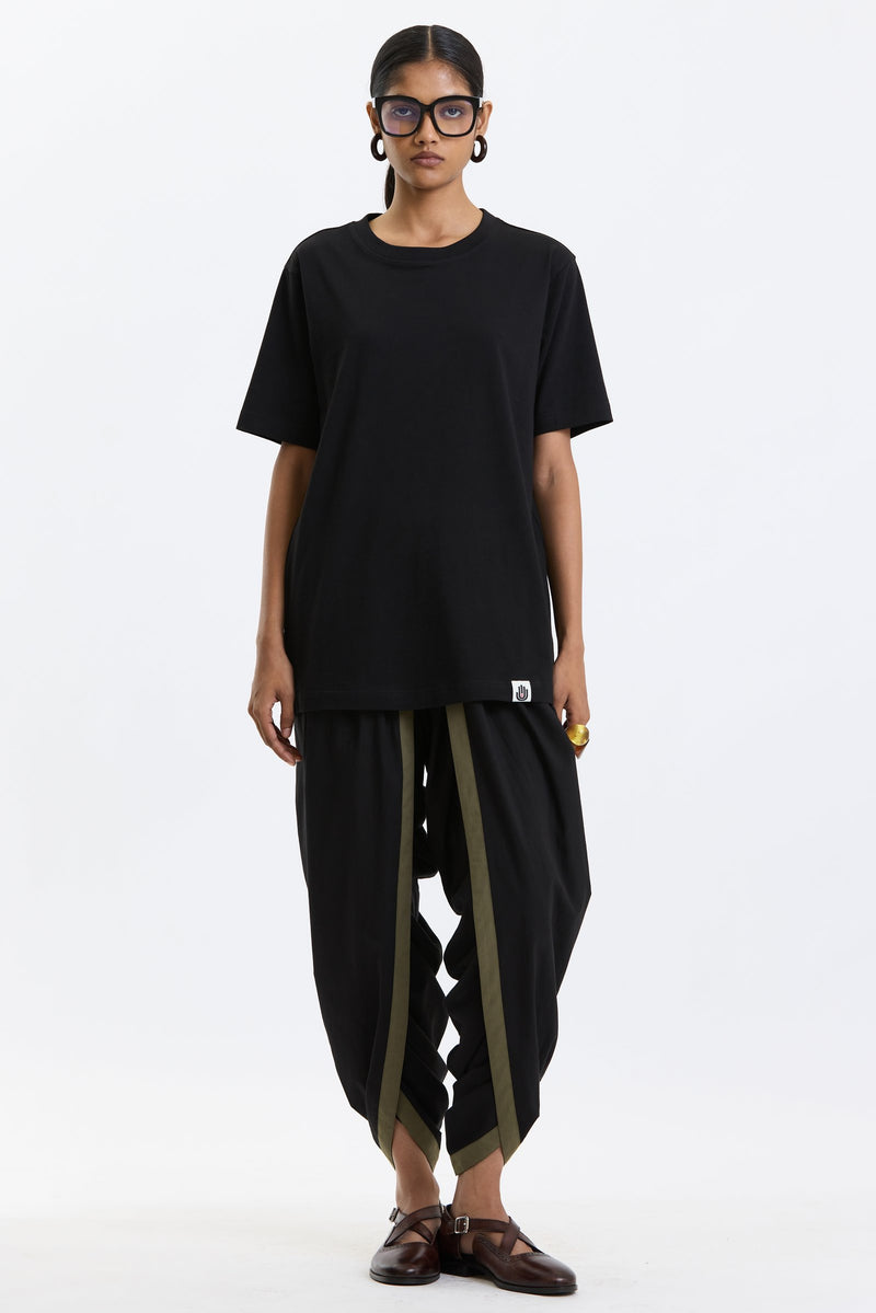 Cotton T-Shirt – Black by Swasthii, worn by a model – view 1
