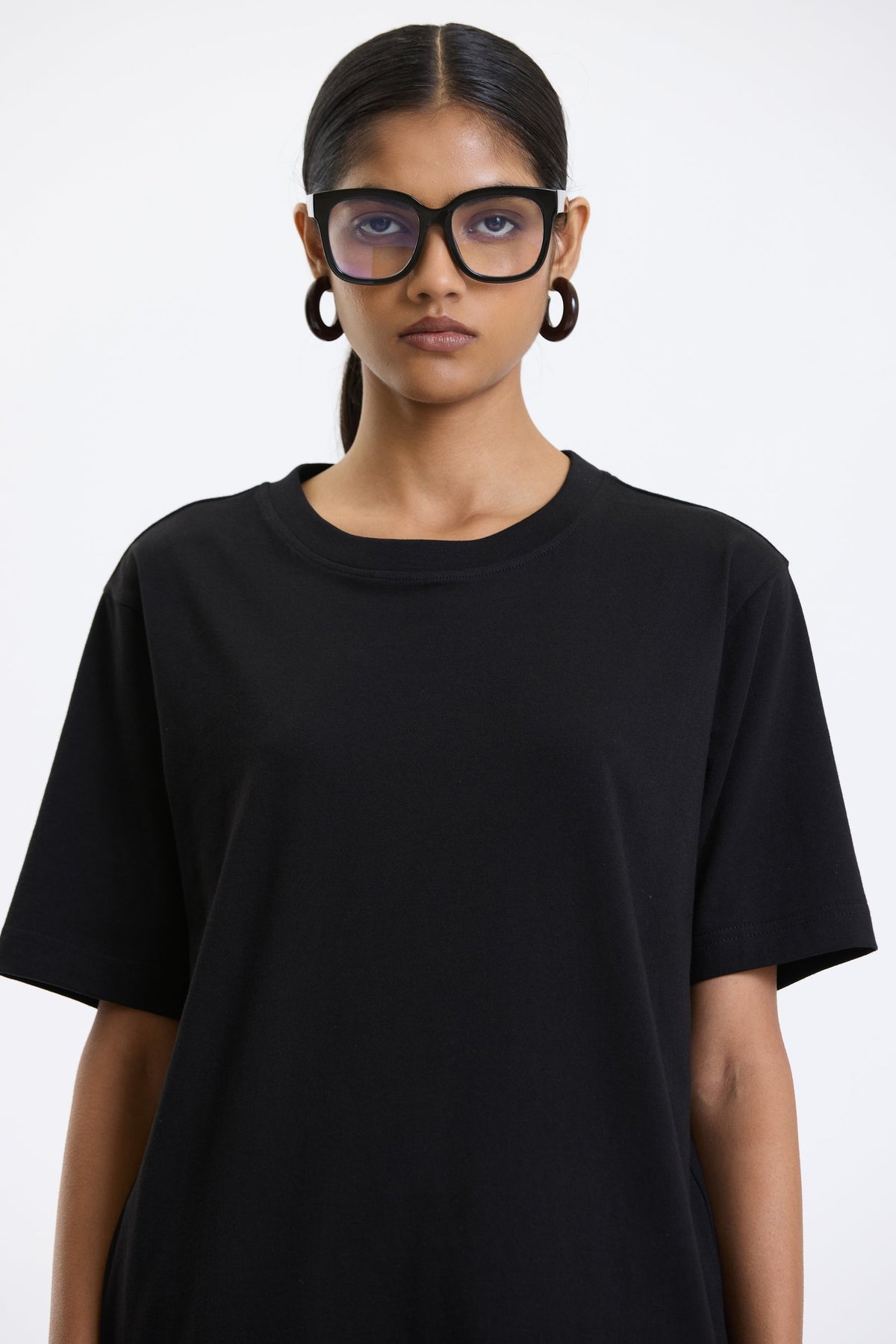 Cotton T-Shirt – Black by Swasthii, worn by a model – view 2